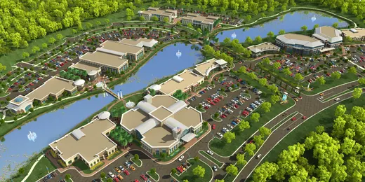 Aerial rendering of a community arranged around water and shared gathering places